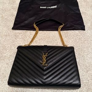 Saint Laurent Black Chevron Bag with Gold Accents